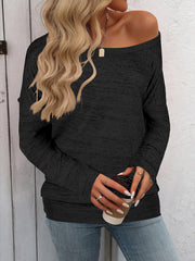 Black heathered knit off-the-shoulder sweater with long sleeves.