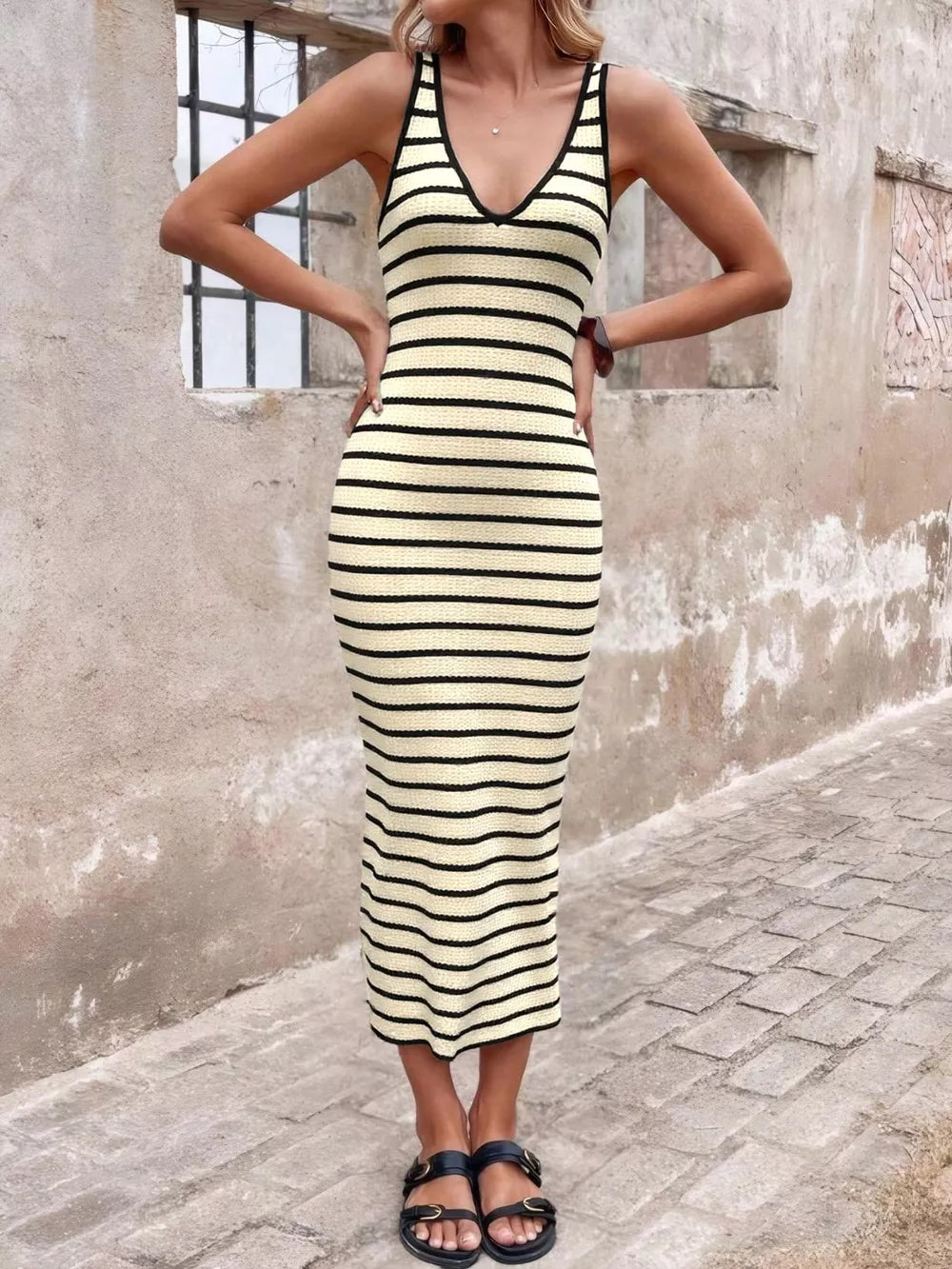 Ribbed striped bodycon midi dress in cream with black trim and V-neck.