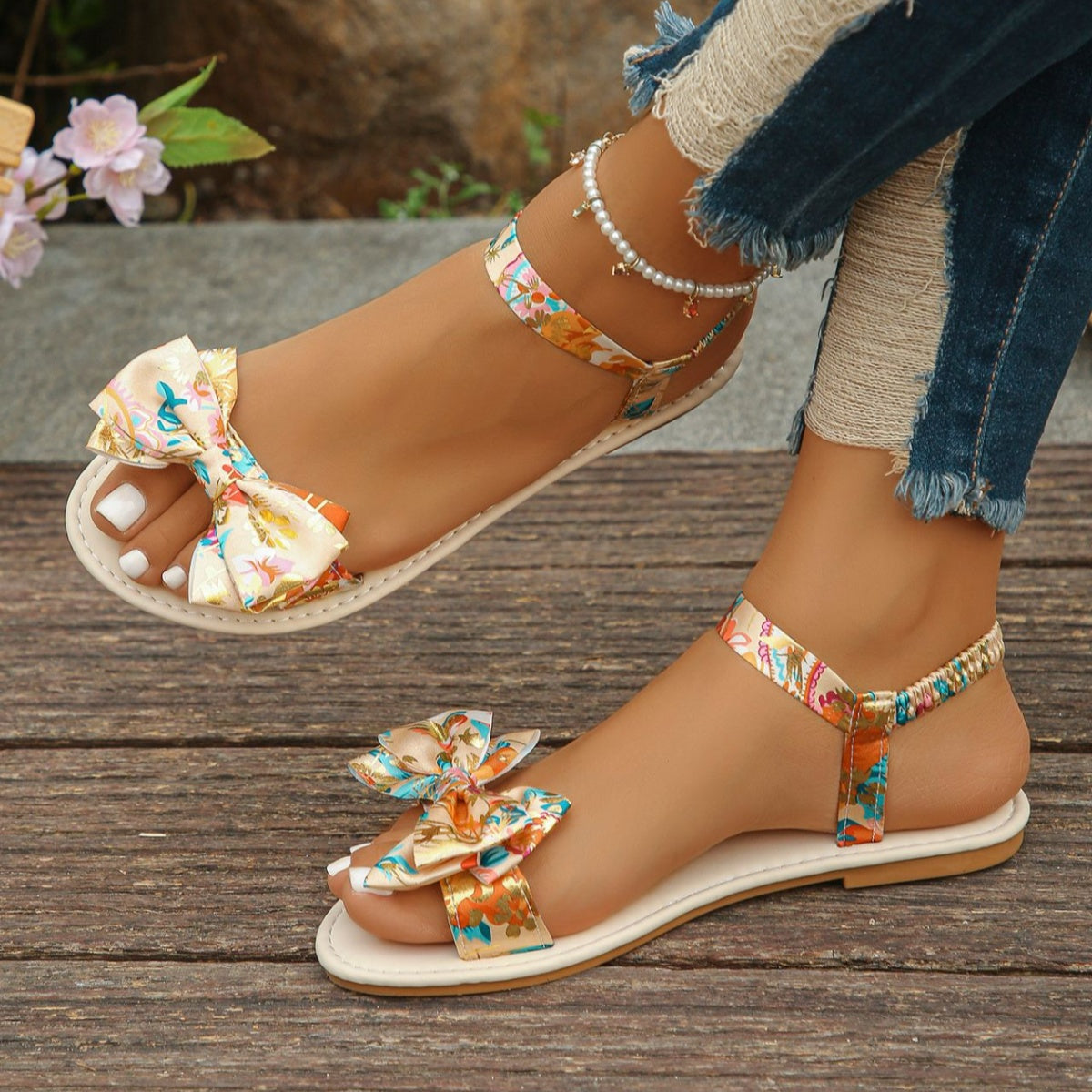 Beige floral bowknot flat sandals for women, casual and comfortable.
