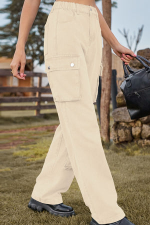 Tan denim cargo pants with relaxed wide legs and utility pockets.