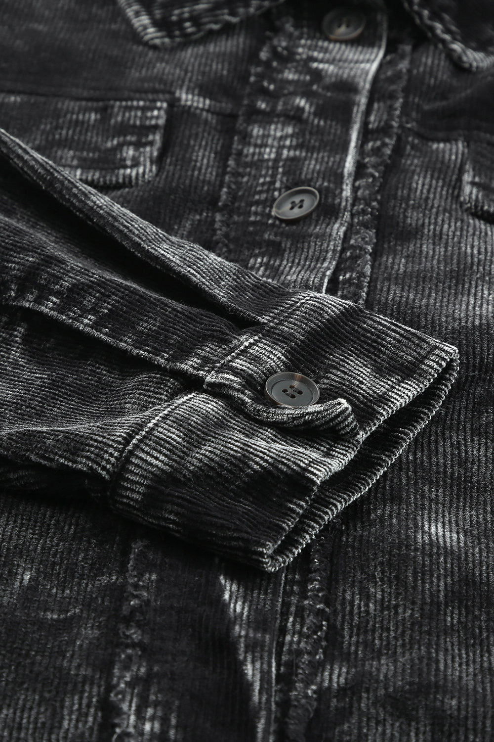 Black corduroy overshirt with faded wash detail, button cuff and chest pocket.