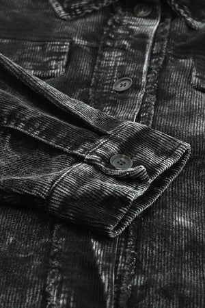 Black corduroy overshirt with faded wash detail, button cuff and chest pocket.