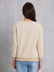 Khaki sweatshirt with crew neck and ribbed cuffs and hem.