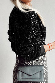 Black sequin embellished sweatshirt with ribbed cuffs and crew neck.