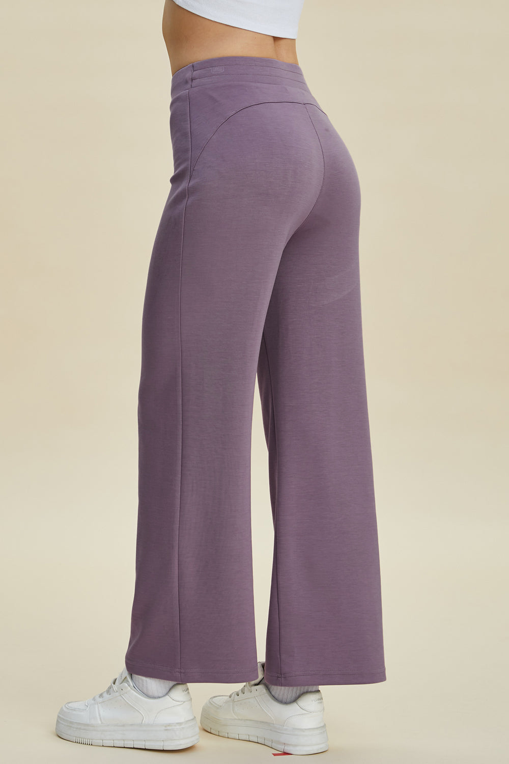 Soft drape wide leg lounge pants in Moonlit Mauve with a high waist and flared hem.
