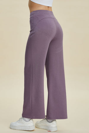 Soft drape wide leg lounge pants in Moonlit Mauve with a high waist and flared hem.