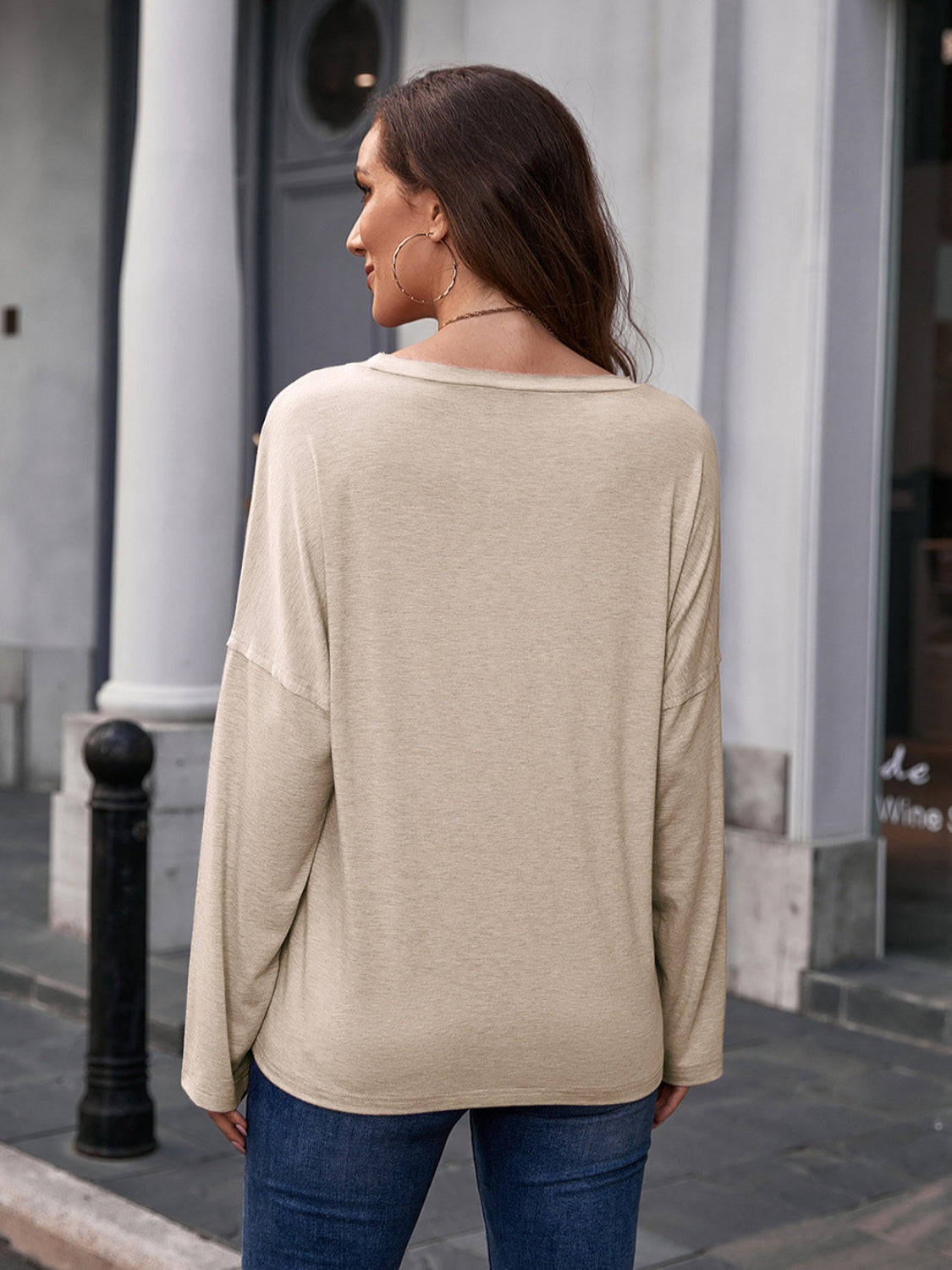 Ivory slouchy tee with long sleeves and a relaxed fit.
