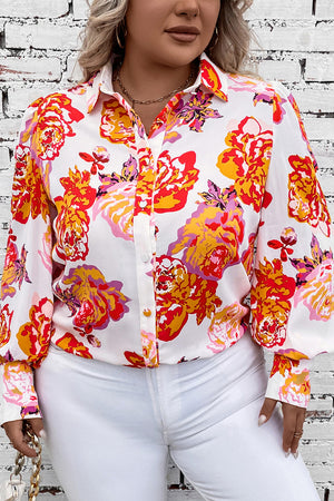 Blouse with floral print, blouson sleeves, and button front, styled with white pants.