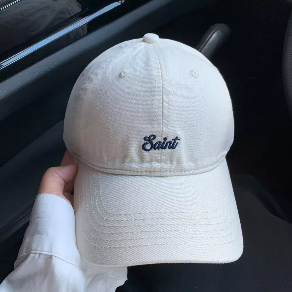 Off-white cotton baseball cap with embroidered script detail