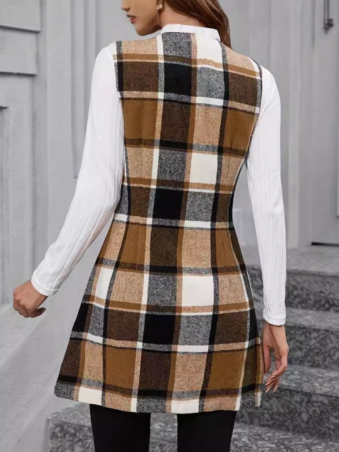 Tartan tailored longline vest in camel with button detail, worn over a white long-sleeve top.