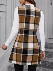 Tartan tailored longline vest in camel with button detail, worn over a white long-sleeve top.