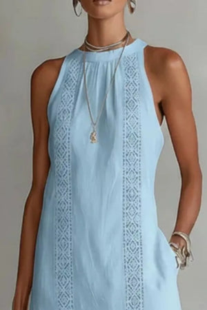 Light blue midi dress with pockets and lace trim details.