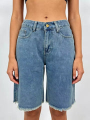 Blue denim bermuda shorts with frayed hem and relaxed fit.