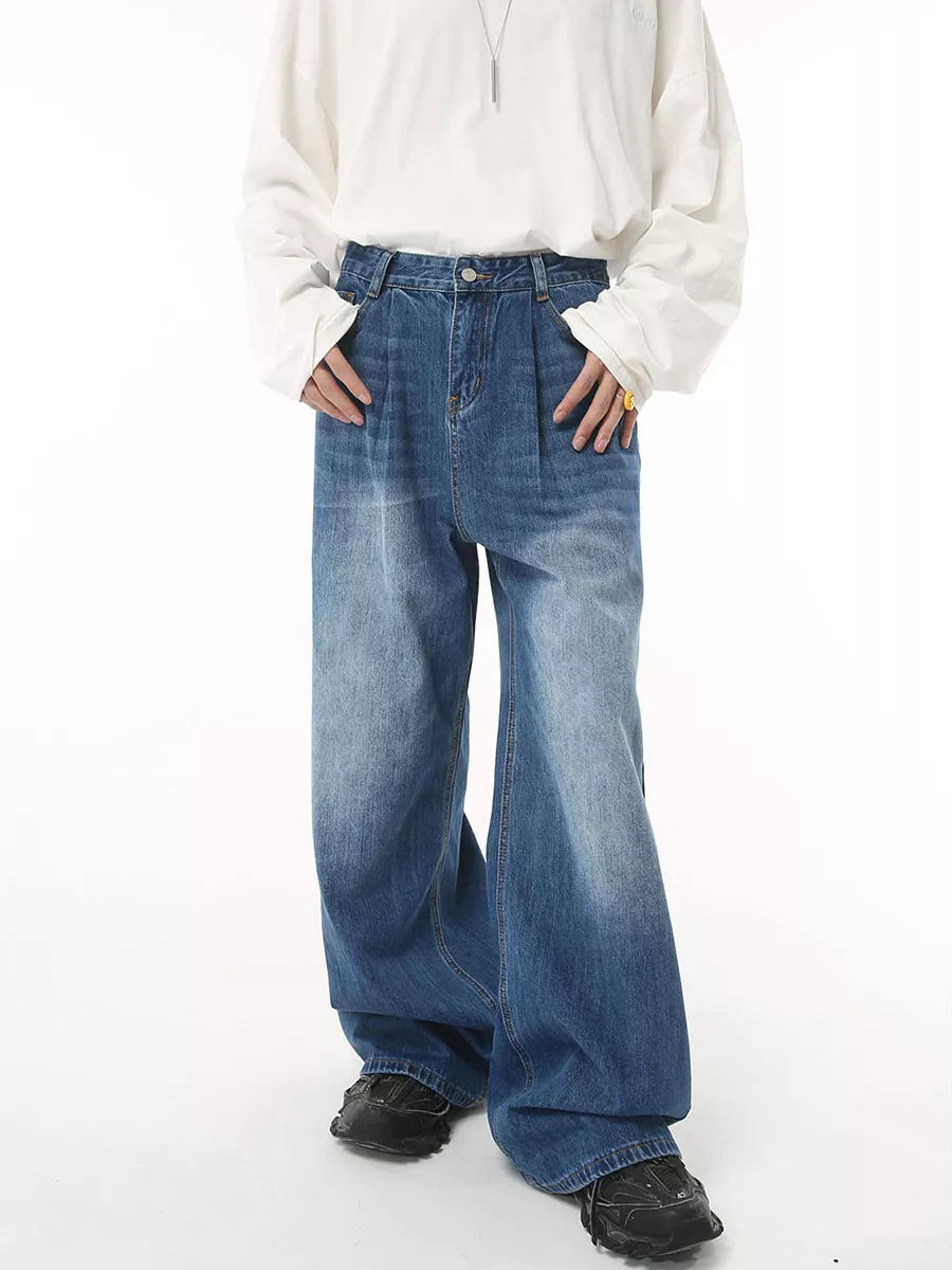 Men's wide leg denim jeans in blue wash with a relaxed fit.
