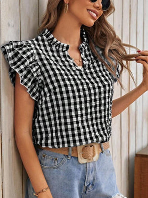 Black and white gingham ruffle sleeve blouse with a mock neck and v-neck detail.