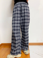 Relaxed plaid drawstring palazzo pants in dusty blue with a wide leg and casual fit.