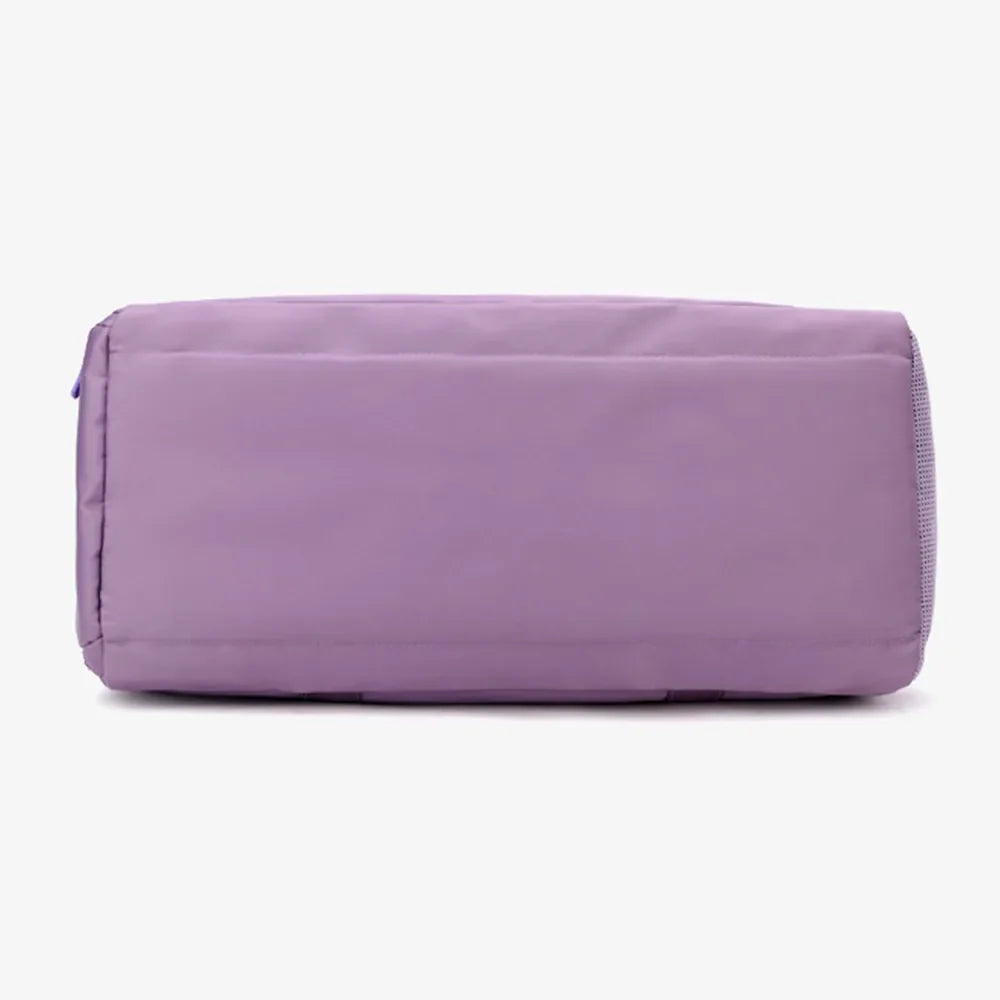 Mauve nylon duffle bag with mesh pocket detail on the side.