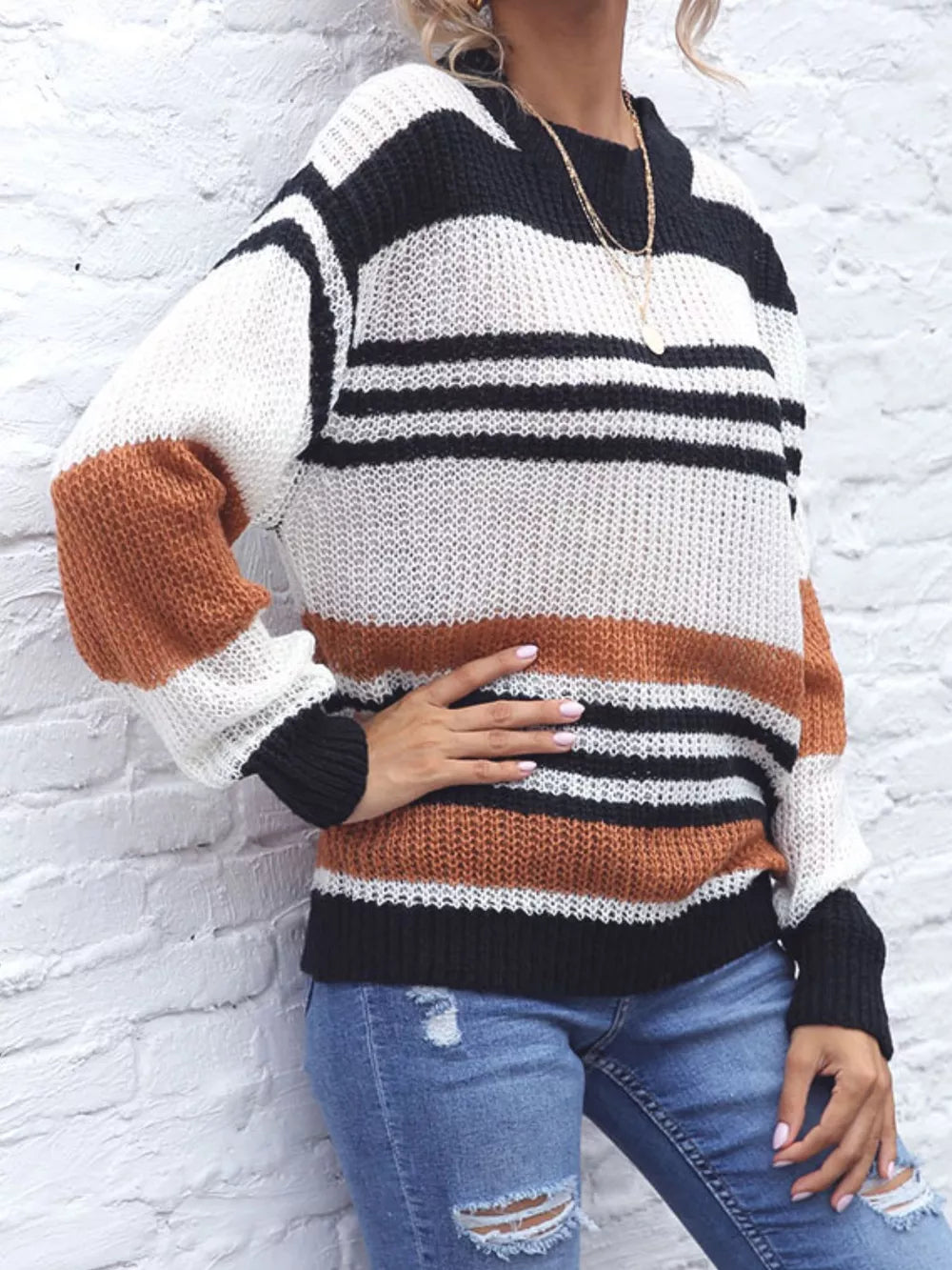 Casual striped knit sweater with color block accents in white, black, and rust brown acrylic.