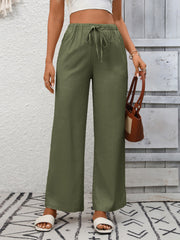 Army green high-waist wide-leg pants with drawstring detail and elastic waistband.