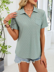 Sage eyelet polo collar blouse with short sleeves and a chest pocket.
