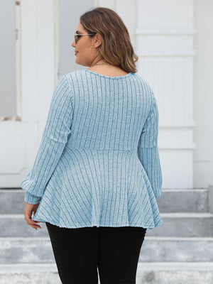 Pastel Blue ribbed peplum knit top with blouson sleeves and a flared hem.
