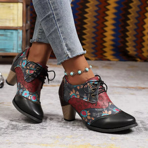 Floral patchwork lace-up ankle boots with block heel and black toe.