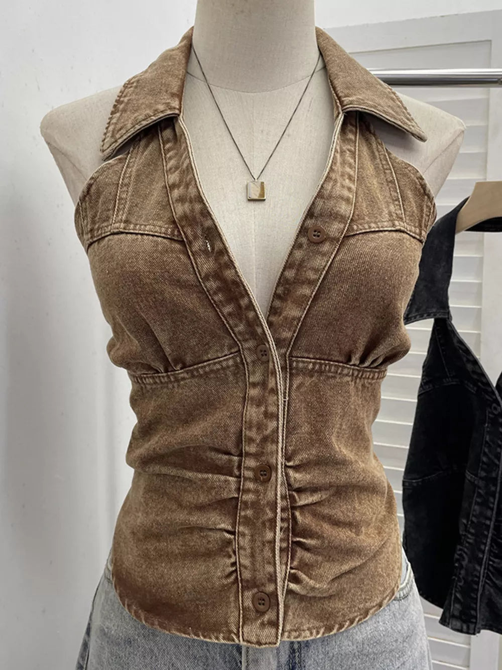 Gathered denim halter top with collar in khaki, buttoned front and ruched sides.