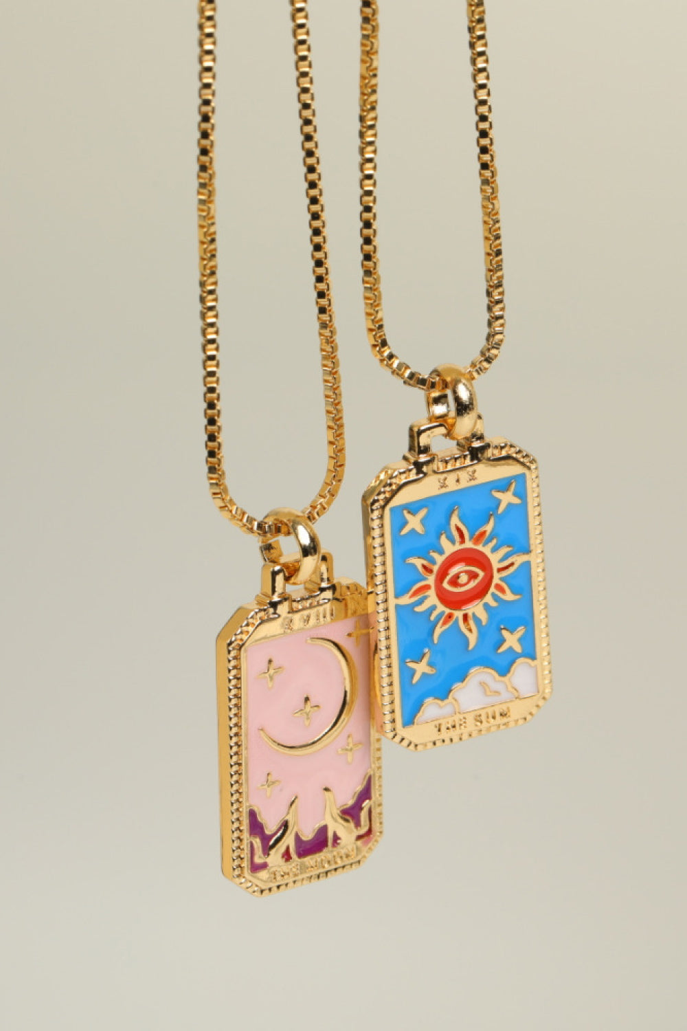 Celestial tarot pendant necklaces in Sun and Moon designs, gold chain, enamel finish