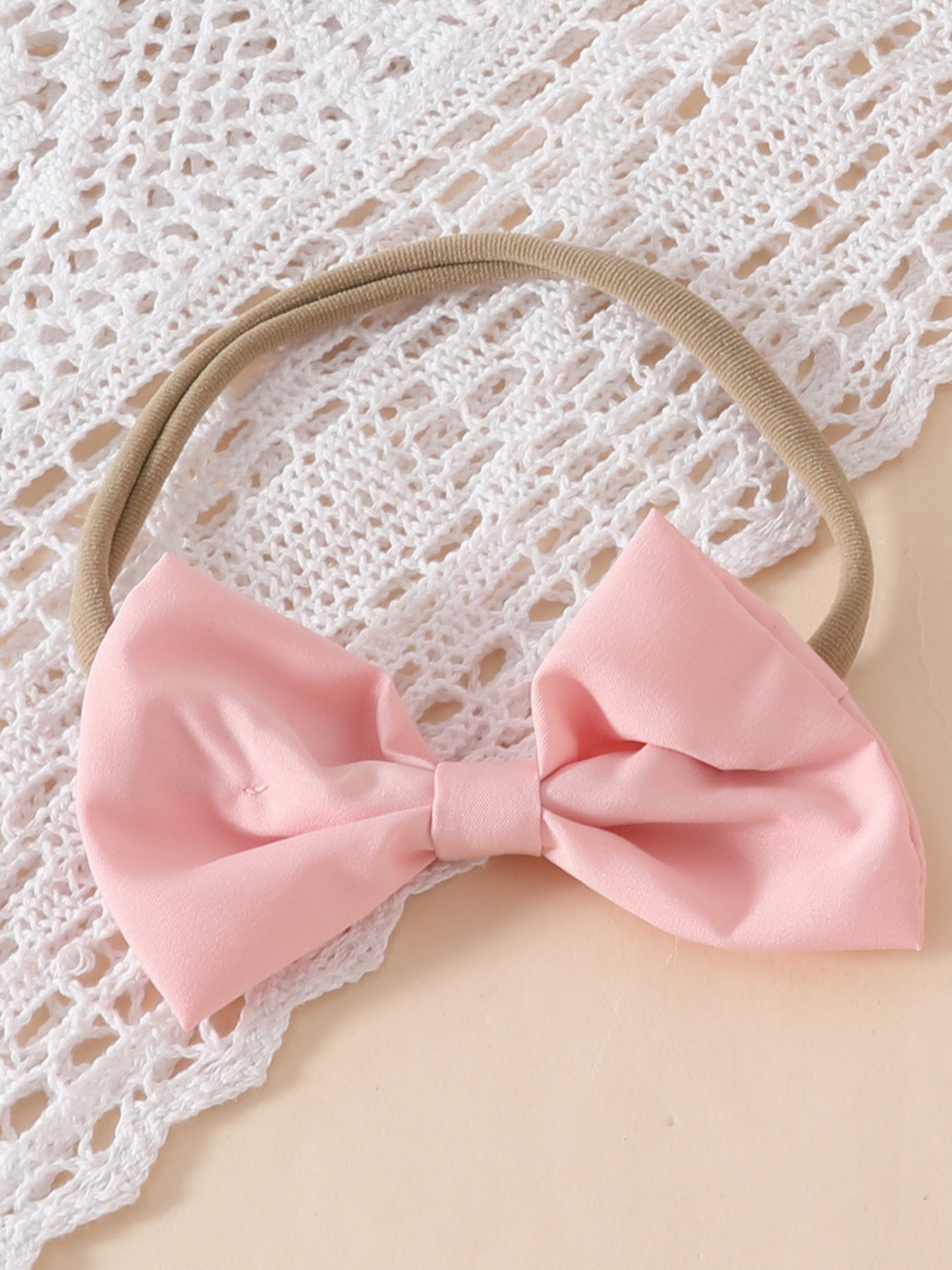 Pink bow headband with lace trim detail