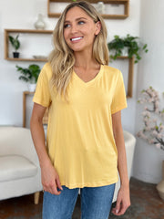 Yellow bamboo v-neck t-shirt with short sleeves and asymmetric hemline