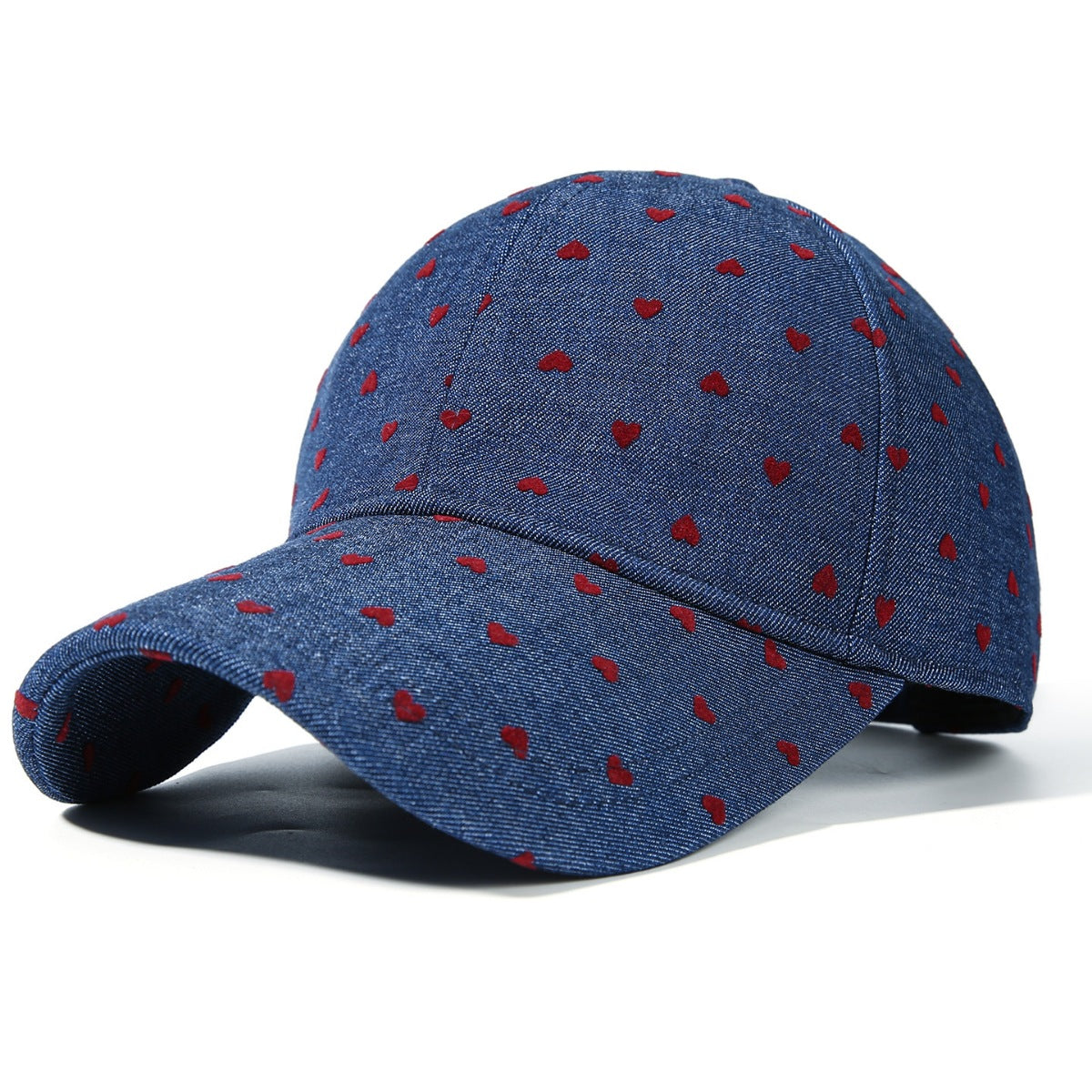 Blue denim baseball cap with all-over red heart pattern