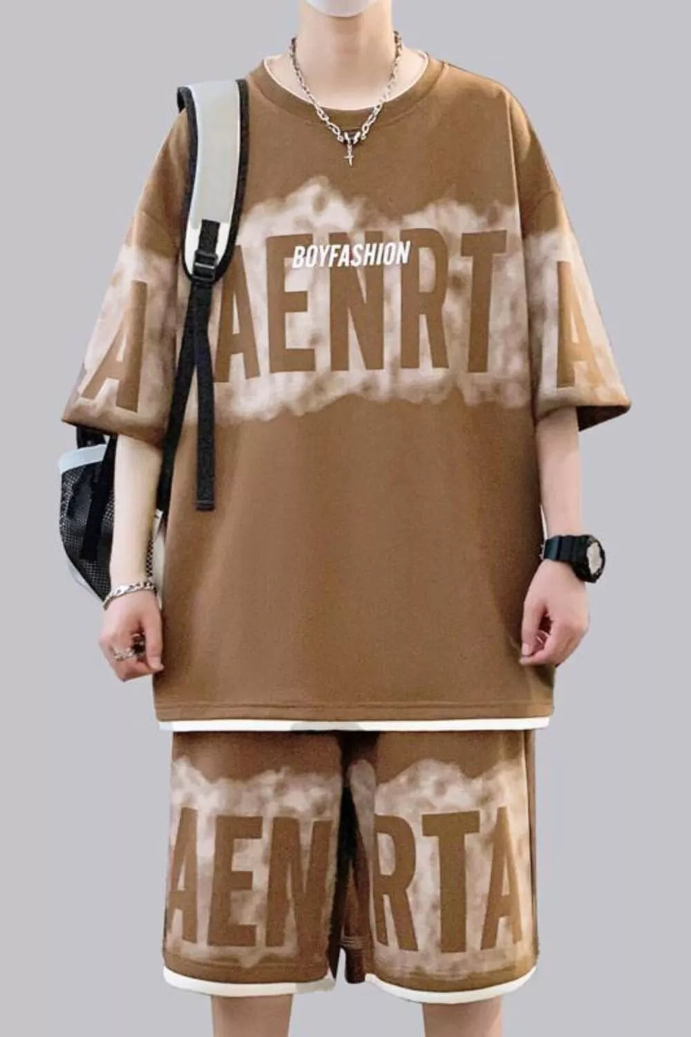 Oversized lettered tee and shorts set in caramel with tie-dye effect and "BOYFASHION" text detail.