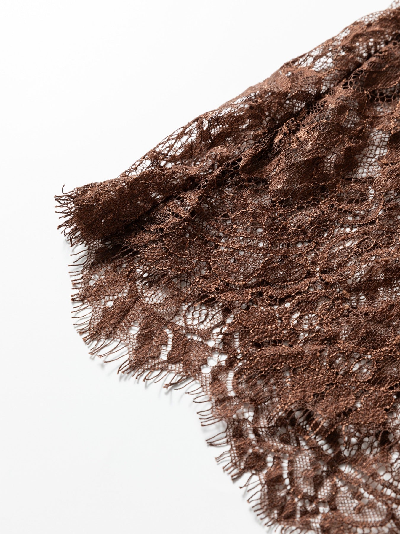 Dark brown floral lace maxi dress fabric detail with frayed hem