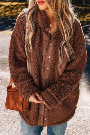 Brown teddy textured utility jacket with button front and contrast panels.