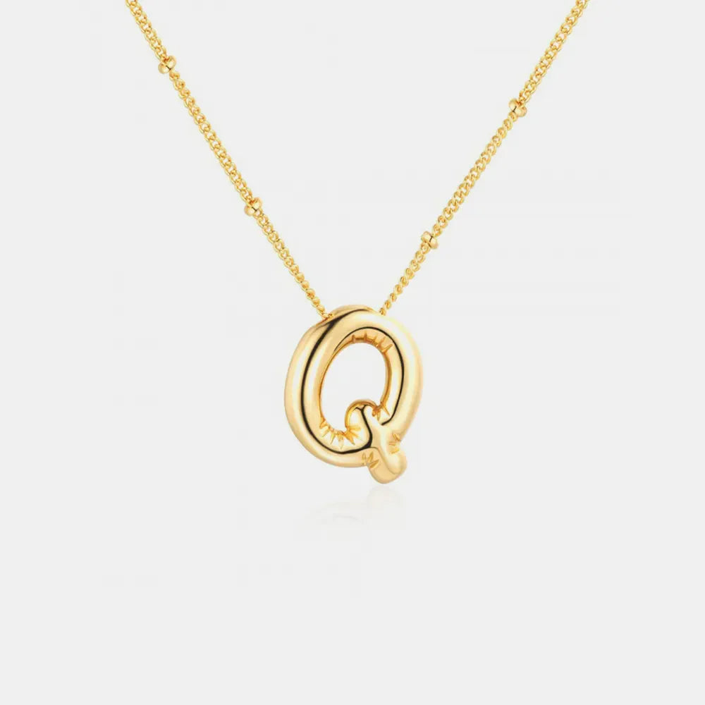Gold initial Q charm necklace with beaded chain