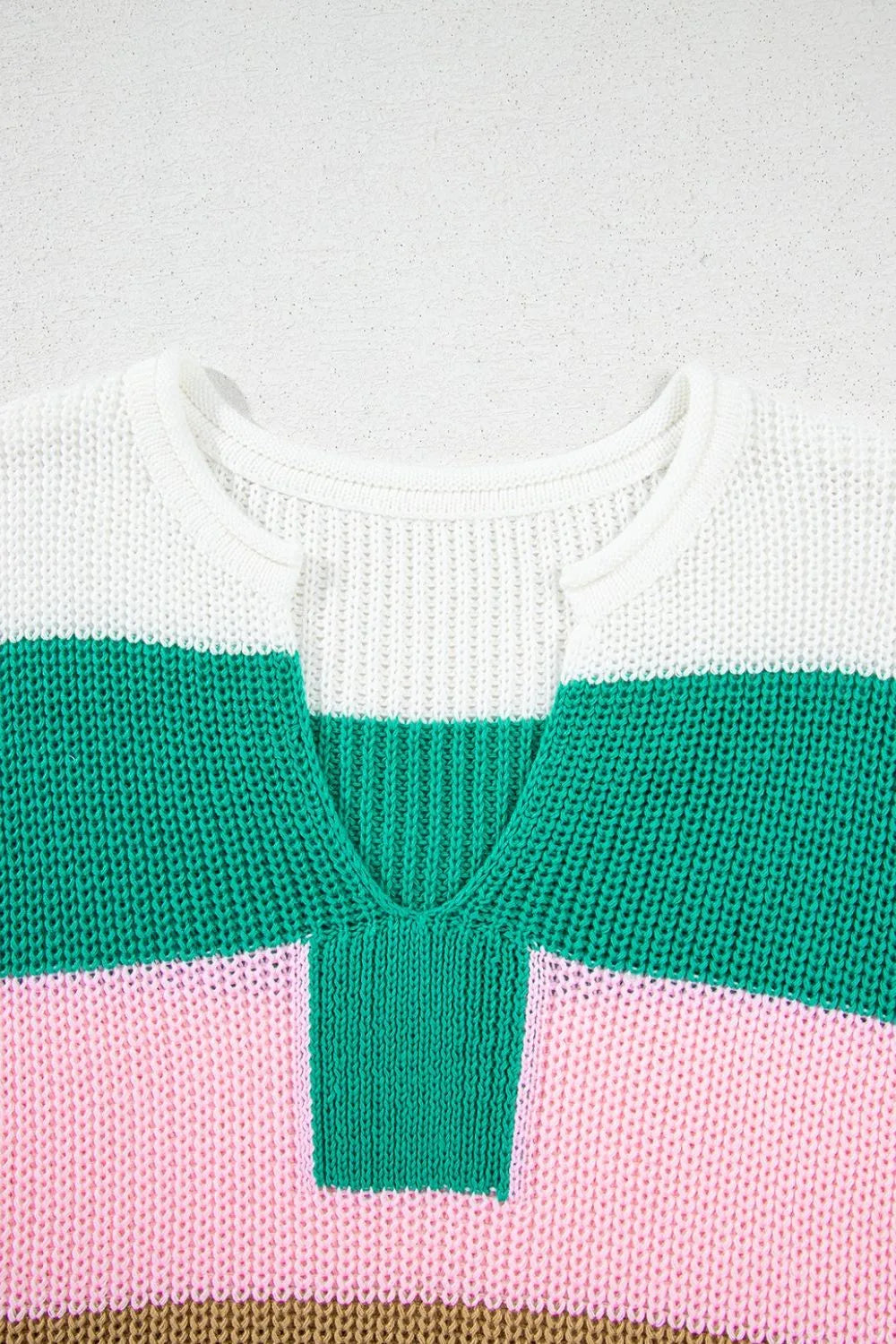 Colorblock knit V-neck tee in multicolor with white, green, and pink stripes.