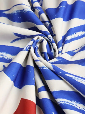 Sardine graphic spaghetti strap midi dress in royal blue and white with a bold brushstroke pattern.