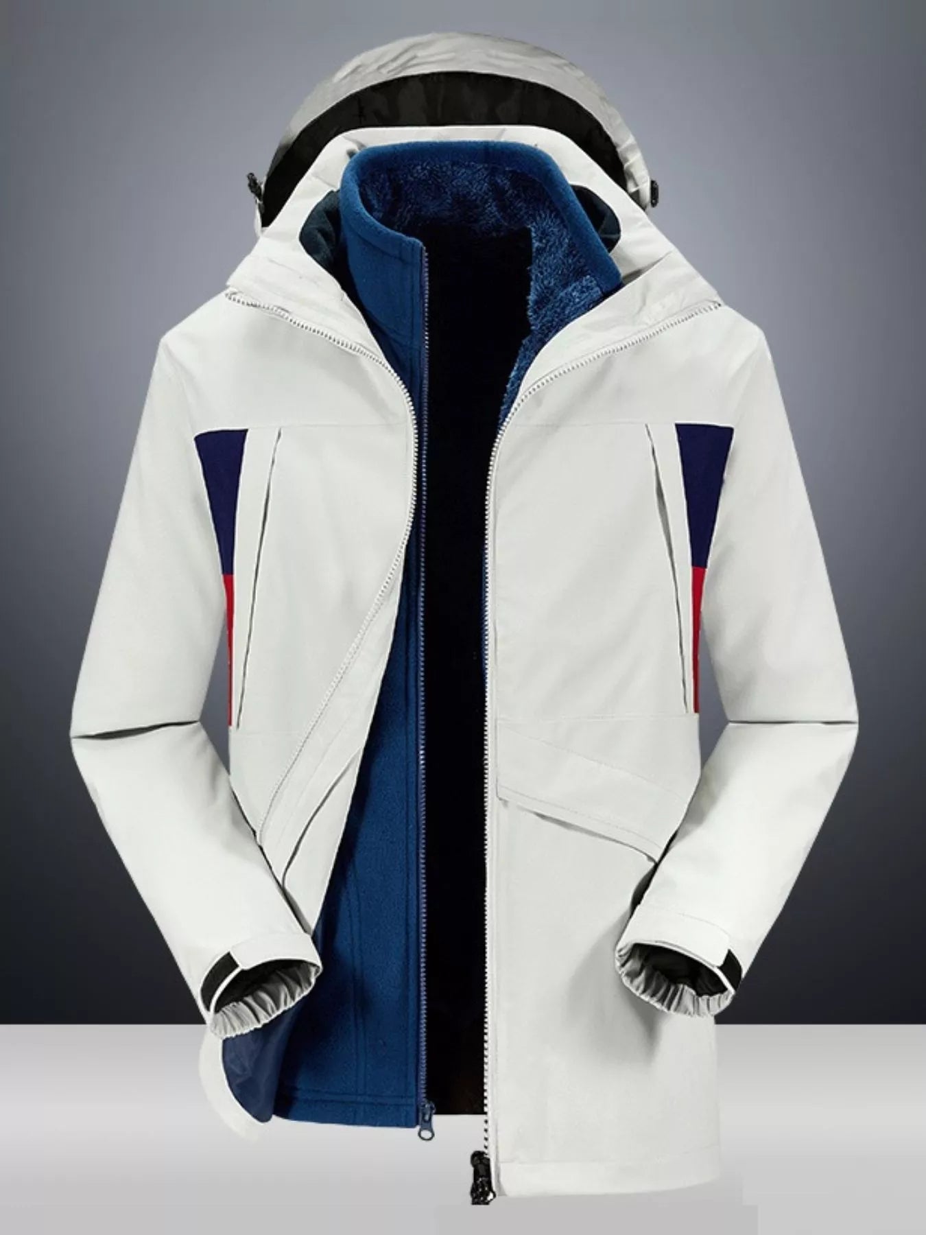 White hooded jacket with blue fleece lining and red and blue stripe accents