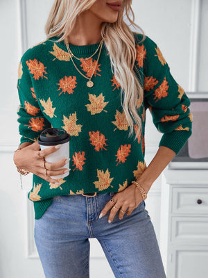 Green knit jumper with autumnal leaf motif, crew neck, long sleeves.