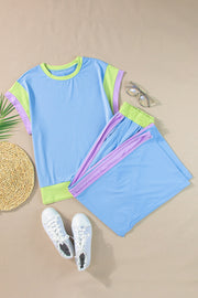 Colorblock sportswear set with light blue top and shorts, contrast trim, and lime green accents.