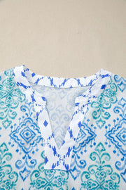 Patchwork babydoll shirt with V-neck and blue/teal ikat print.