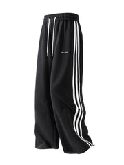 Black men's sweatpants with white side stripes and drawstring waist