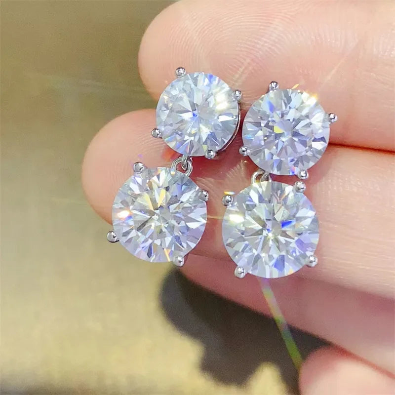 Silver double-drop cubic zirconia stud earrings with four round-cut stones.