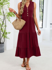 Burgundy tiered midi dress with notched V-neck and decorative buttons.