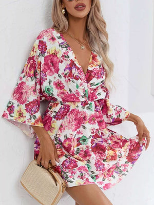 Floral ruffle hem mini dress with a deep V-neck and flared sleeves.