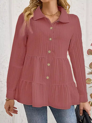 Dusty pink textured tiered button-down shirt with crinkled fabric and button details.