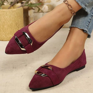 Elegant pointed-toe slip-on flats in burgundy suede with double buckle detail.