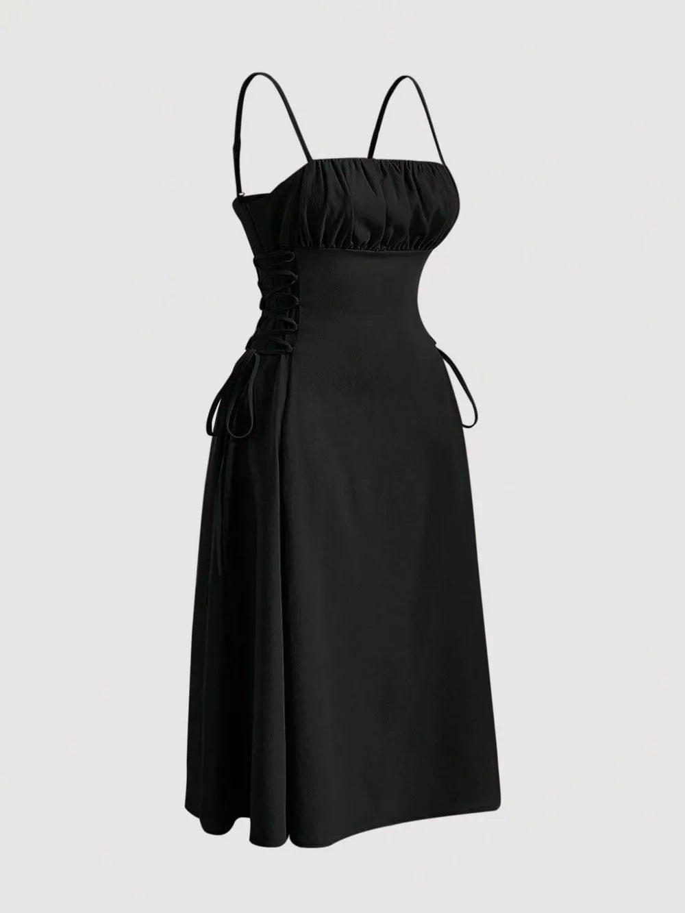 Black cami dress with ruched bodice, crisscross lace-up sides, and A-line skirt.
