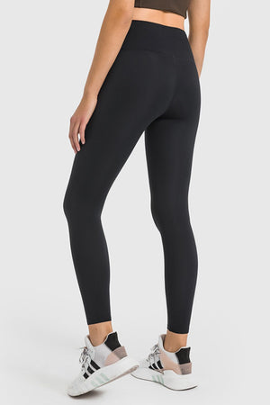 Black high-waist performance leggings with a sculpted fit and ankle length.