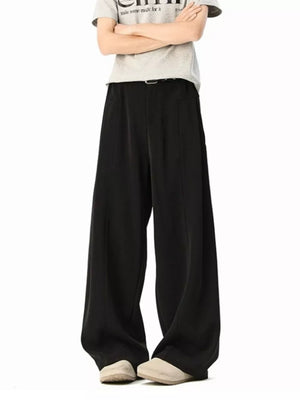 Men's black wide-leg track pants with a relaxed fit and belt detail.